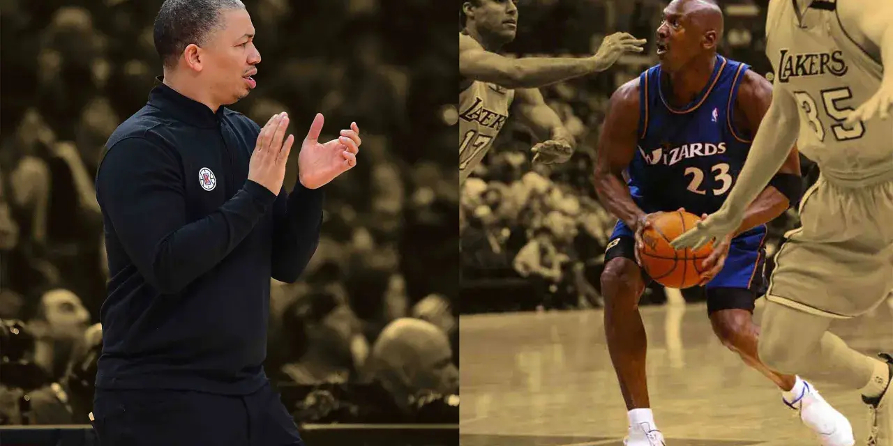 Trener Tyronn Lue klaszcze, podczas gdy Michael Jordan w barwach Wizards z piłką, obok gracza Lakers.