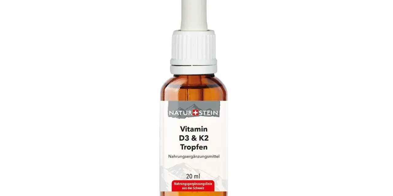 Braune Glasflasche mit Pipette, gefüllt mit Vitamin D3 & K2 Tropfen.