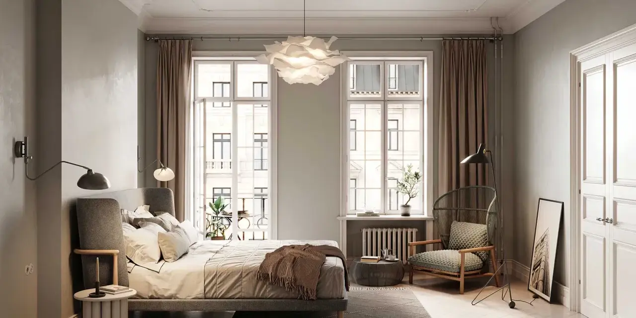 Un elegante bonsai in camera da letto, accanto a un letto accogliente e una poltrona in vimini, crea un'oasi di pace.