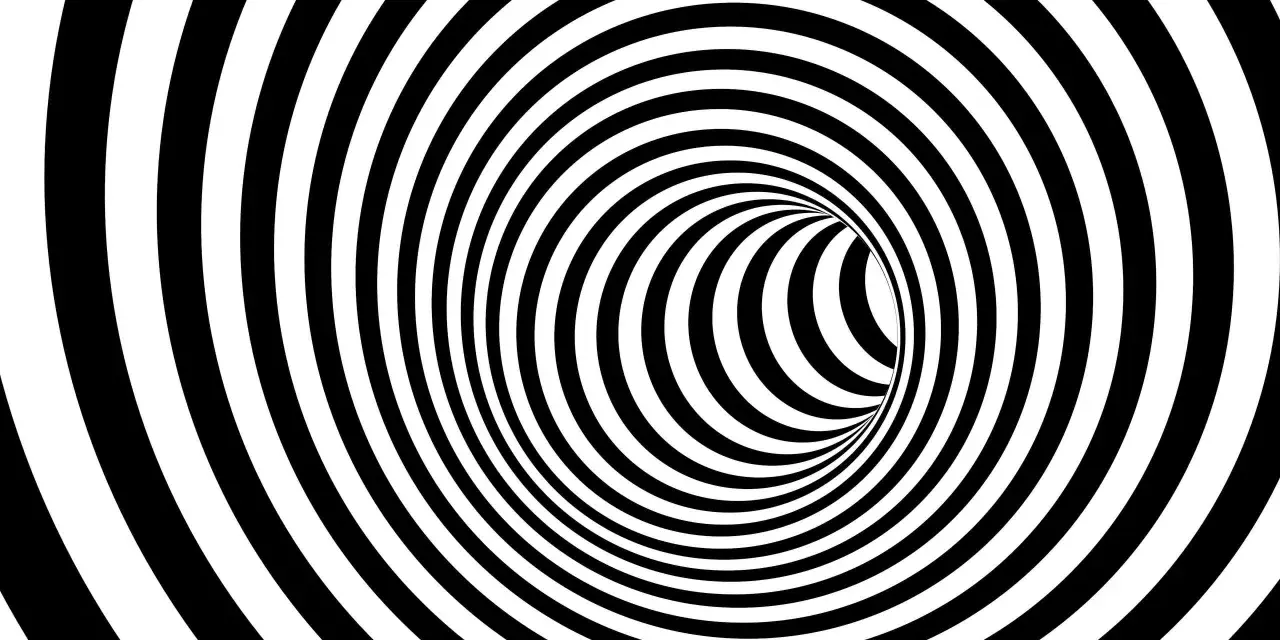 En svartvit tunnel med spiralmönster som kan ge känslan av ångest tankar.