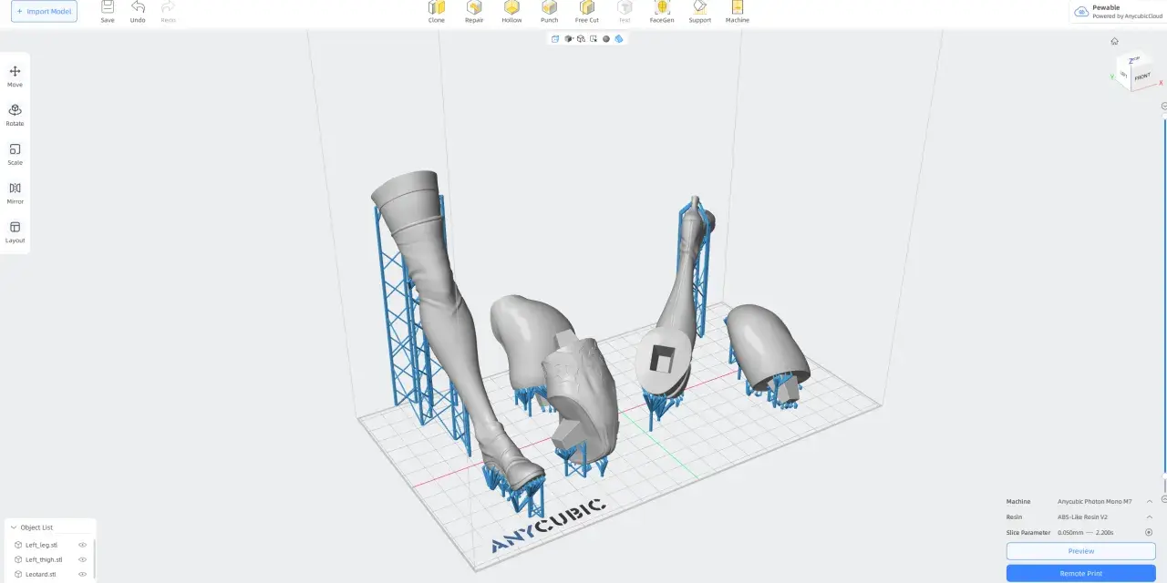 Modele do druku 3D: nogi i strój, przygotowane na platformie Anycubic. Widoczne są podpory, kluczowe dla udanego druku.