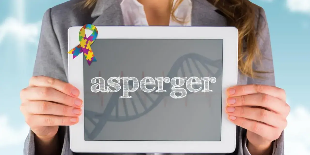 Kolorowa wstążka symbolizuje świadomość autyzmu. Na tablecie widnieje napis "asperger", a w tle grafika DNA, nawiązująca do objawów Aspergera.