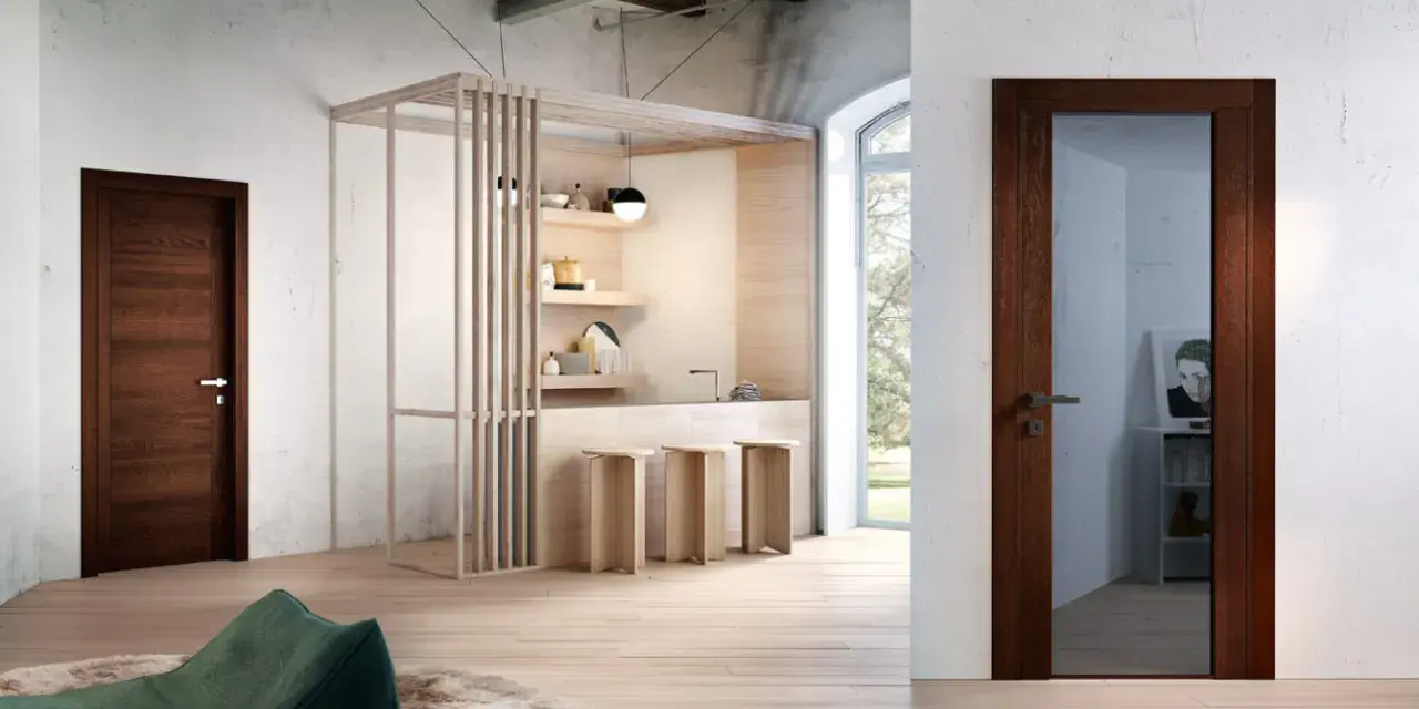 Porta in legno wenge colore, con maniglia in metallo, in un ambiente moderno con cucina a vista e pouf verde.