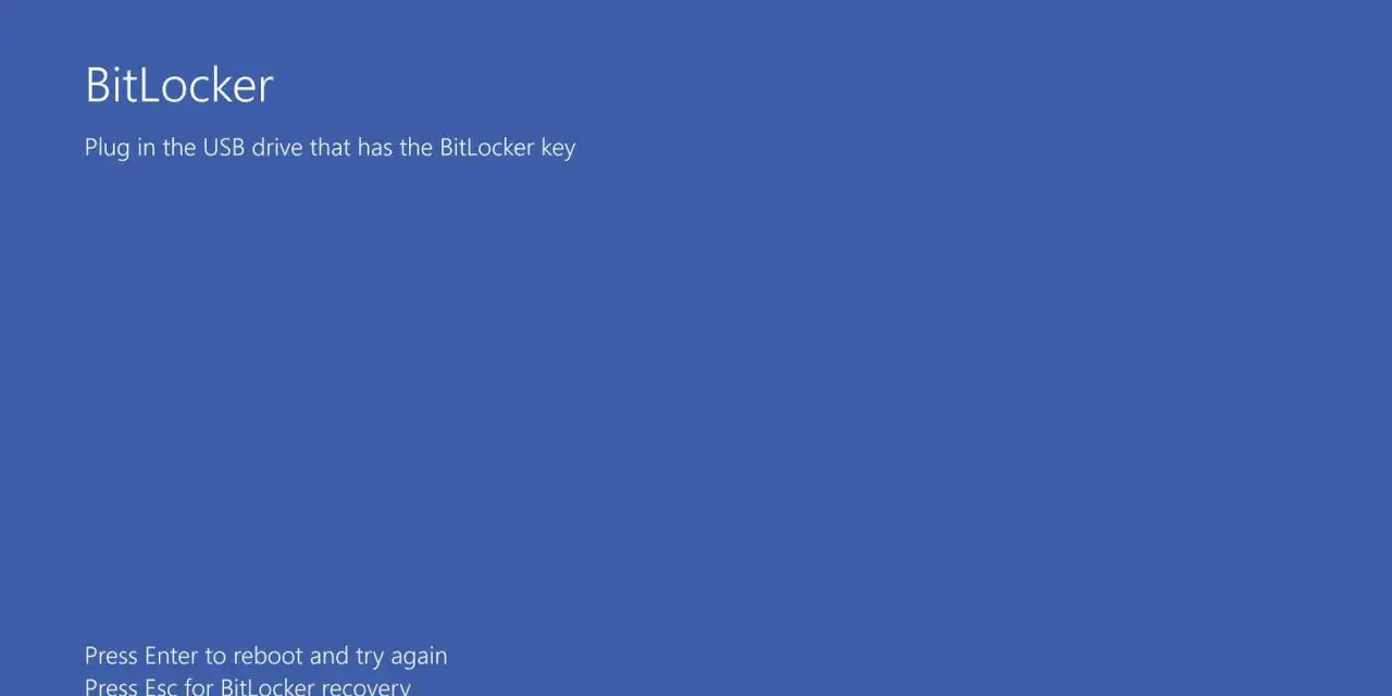 Ekran BitLocker: podłącz USB z kluczem BitLocker. Naciśnij Enter, by zrestartować, lub Esc, by odzyskać dostęp.