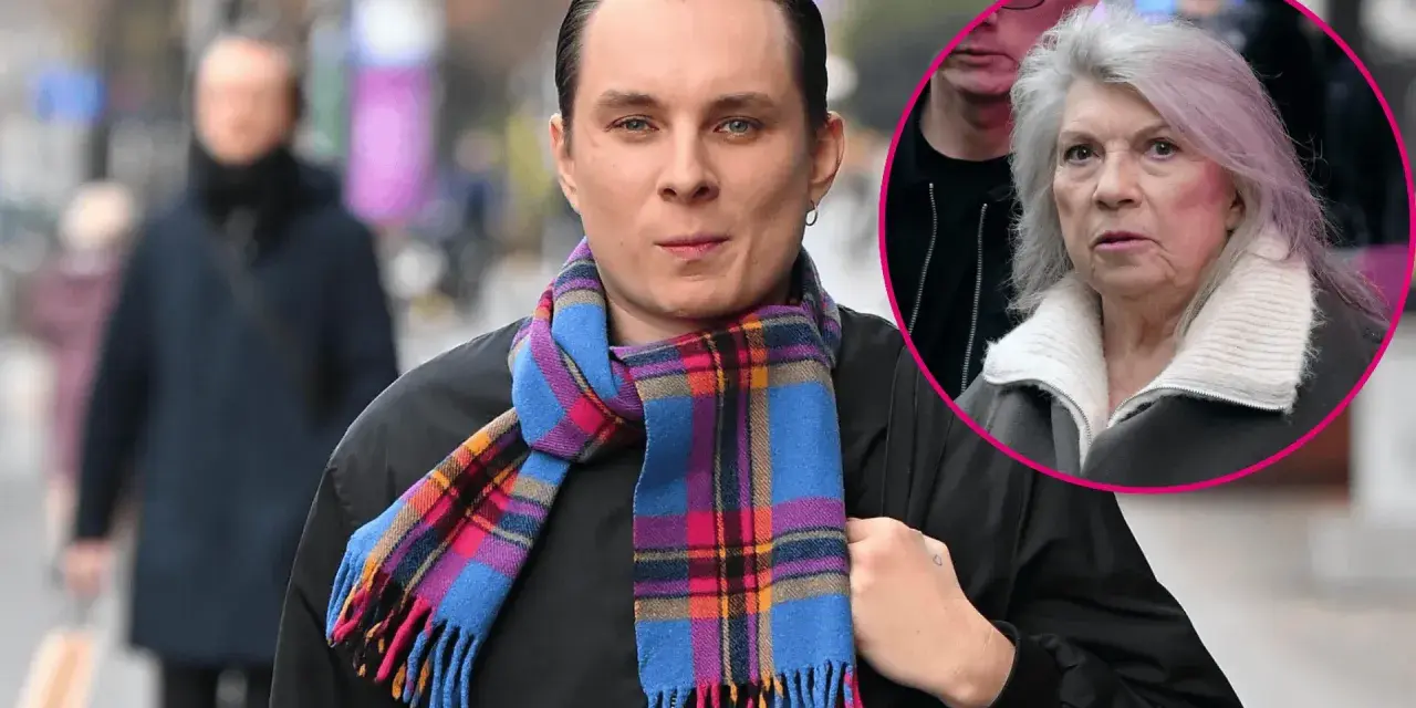 Ralph Kaminski z Krystyną w tle, oboje w jesiennych stylizacjach.