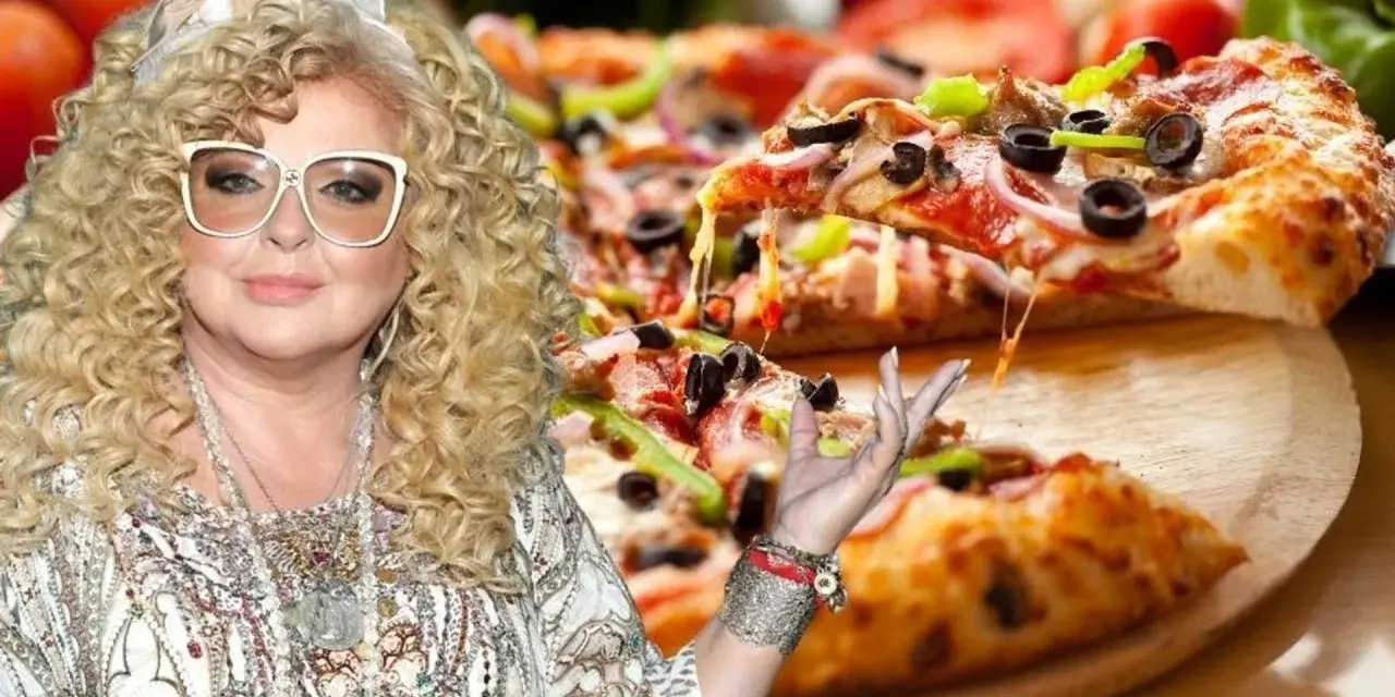 Magda Gessler prezentuje pyszną pizzę z ciągnącym się serem.