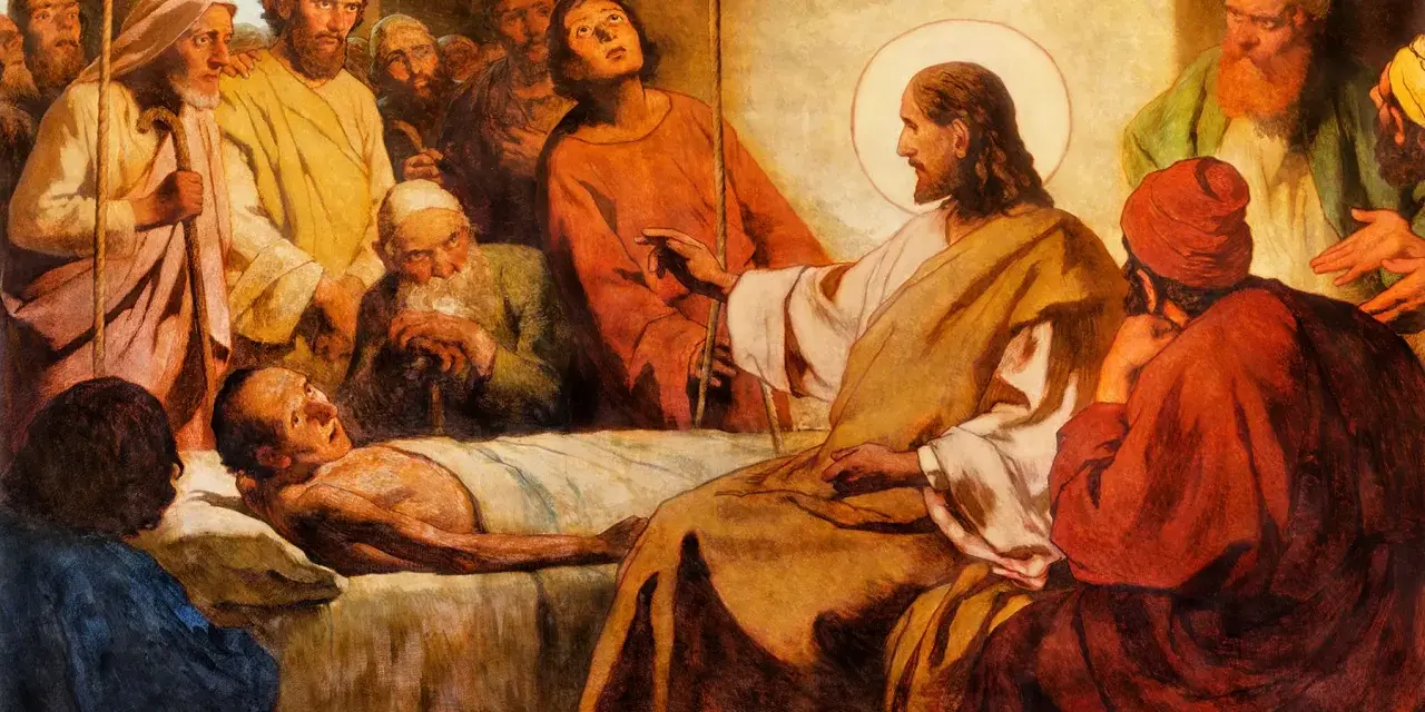 Jesus with a halo touches a sick man lying in bed, surrounded by onlookers.