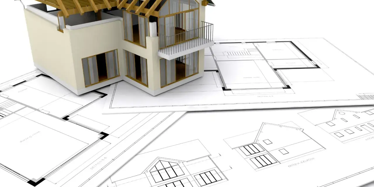 Model domu na planach architektonicznych. Zastanawiasz się, ile trwa budowa domu? To zależy od wielu czynników.