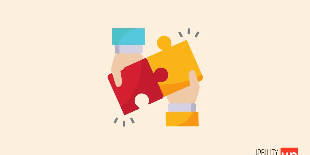 Due mani uniscono due pezzi di un puzzle, rosso e giallo. Un'immagine che sembrava autismo invece, ora rappresenta la collaborazione.