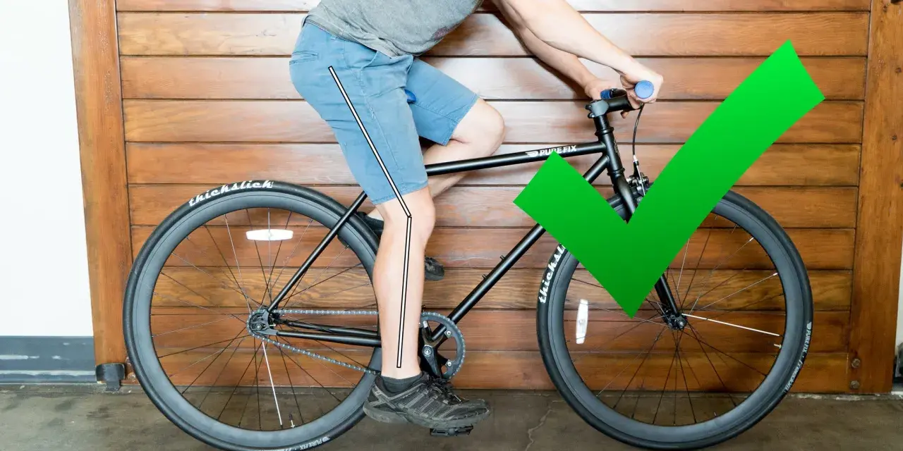 A cyclist demonstrates proper bike seat height with a slight knee bend at the bottom of the pedal stroke. A green checkmark confirms the correct adjustment.