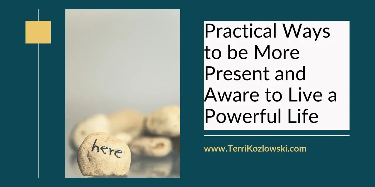 A stone with "here" written on it, symbolizing how to be present and live a powerful life.