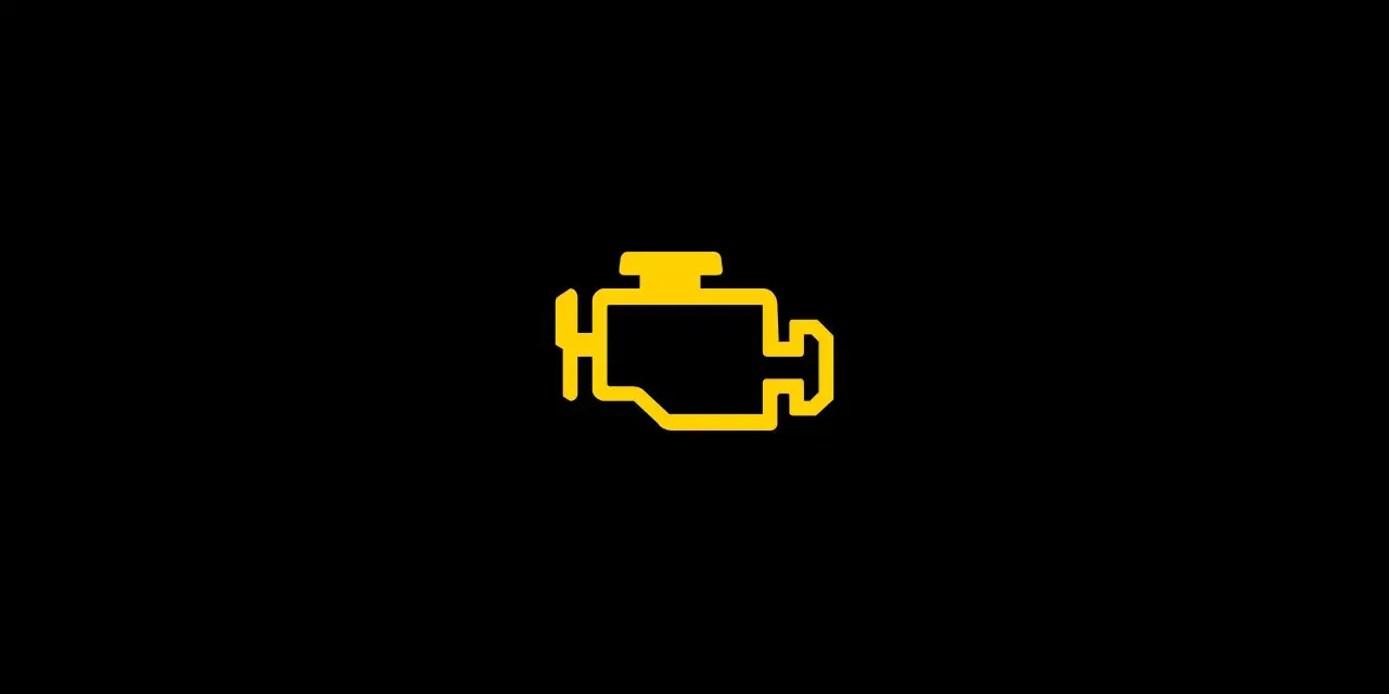 Gelbe Motorkontrollleuchte leuchtet auf dem Armaturenbrett eines VW Tiguan 2.0 TDI.