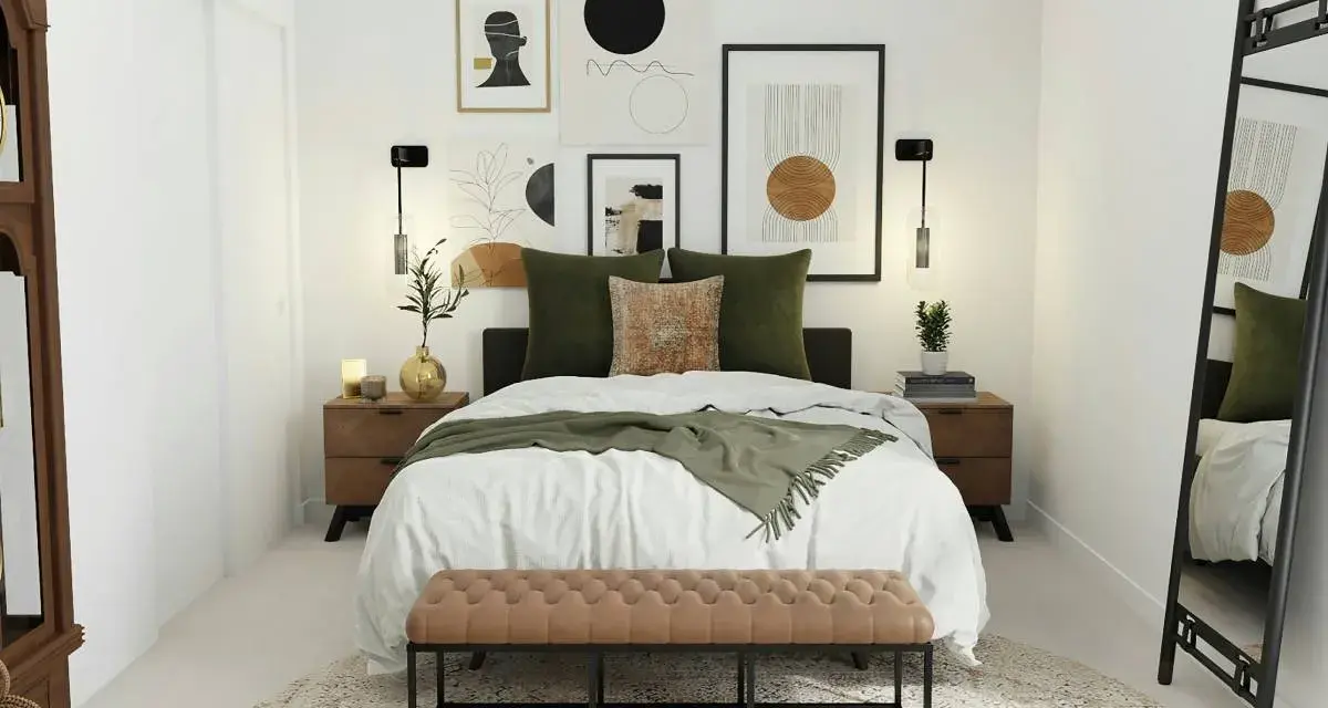 Elegante decoracion habitacion matrimonio con cama blanca, cojines verdes y banco de piel. Arte abstracto en la pared.