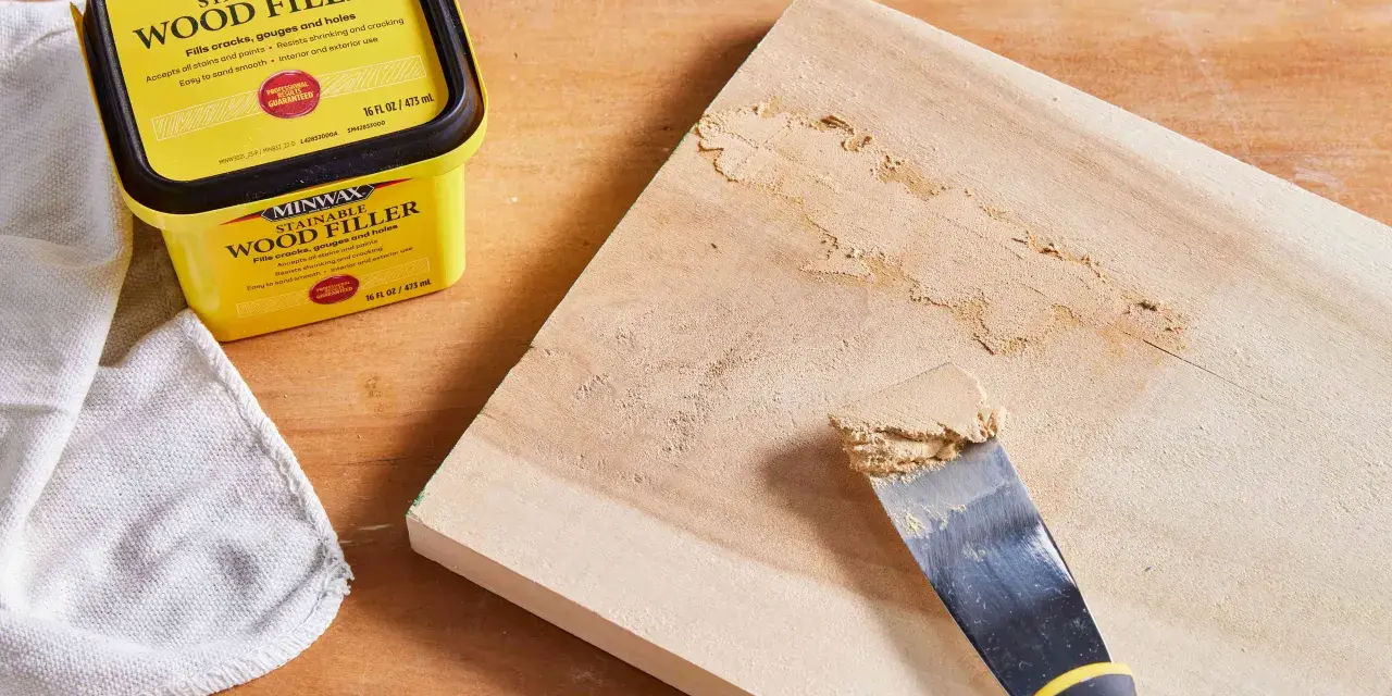 Learn how to use wood filler to repair cracks and gouges on wood. A Minwax container and putty knife are shown.