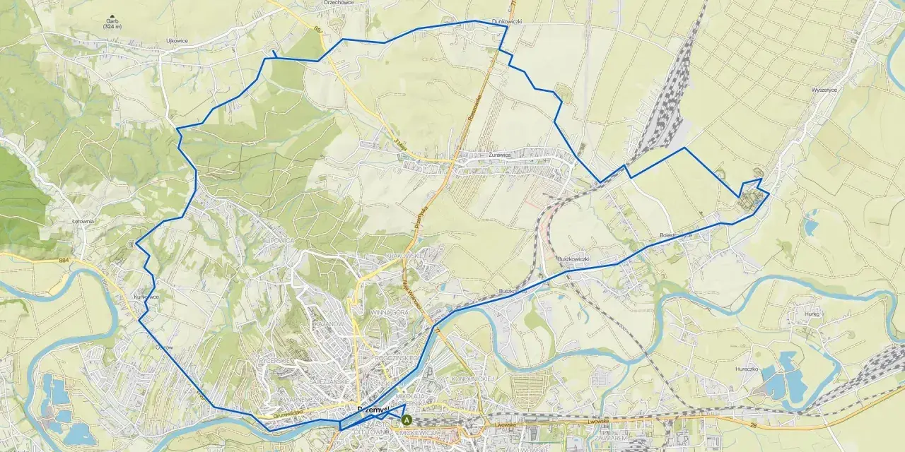 Mapa z zaznaczoną pętlą tras rowerowych w Polsce, prowadzącą przez tereny zielone i okolice Przemyśla.