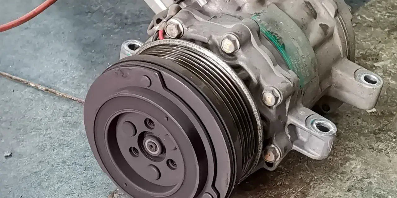 A car's AC compressor, a key component for cool air. Considering the ac compressor replacement cost? This part is vital for your comfort.