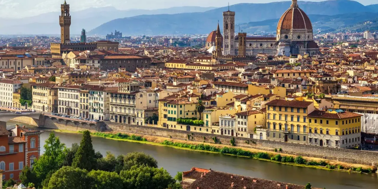 Florence skyline with the Arno River, featuring the Duomo and Palazzo Vecchio, iconic landmarks near the Uffizi Gallery and Accademia.