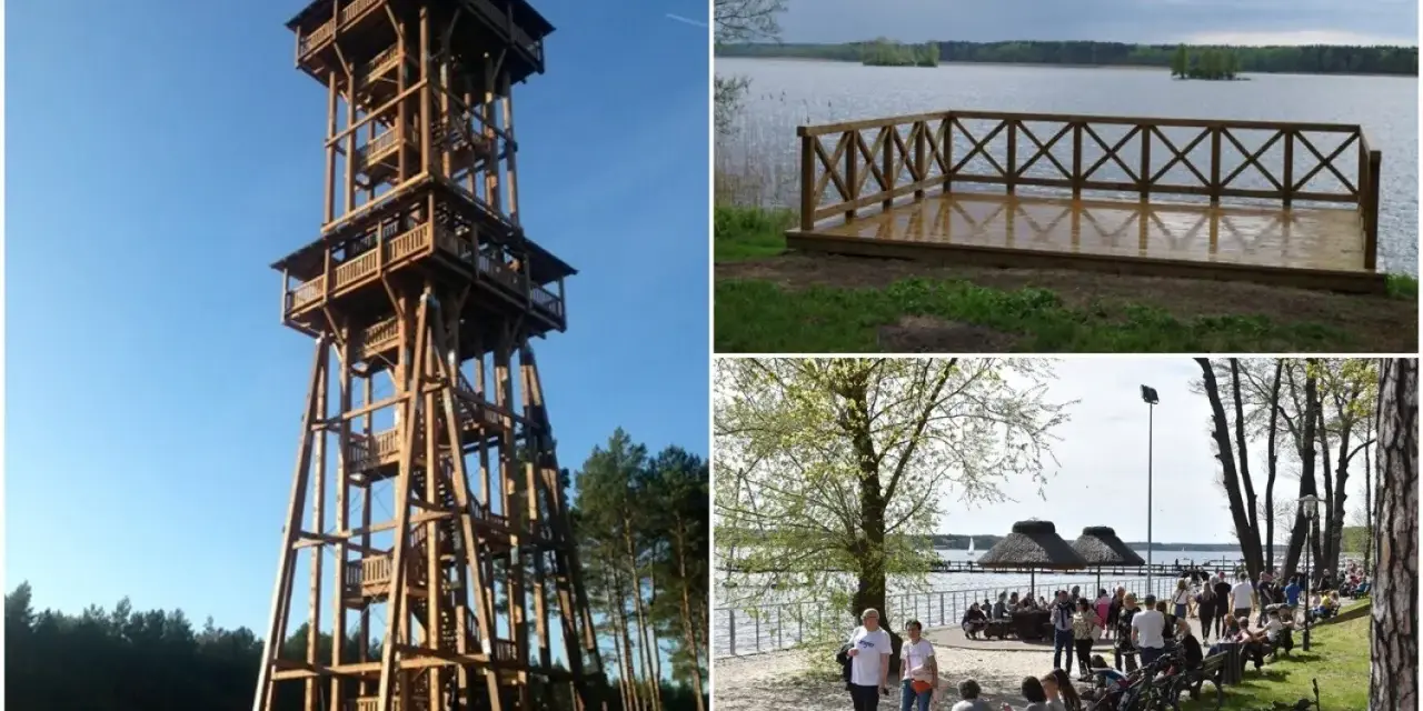 Wysoka, drewniana wieża widokowa Joanna góruje nad lasem. Obok jezioro z pomostem i plaża z ludźmi.