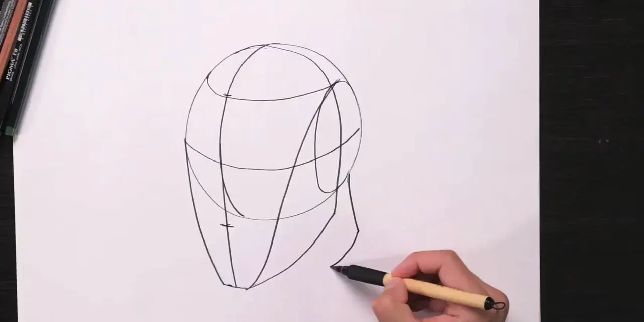 Un boceto de cabeza con líneas guía, parte de una lección de retratos fáciles.