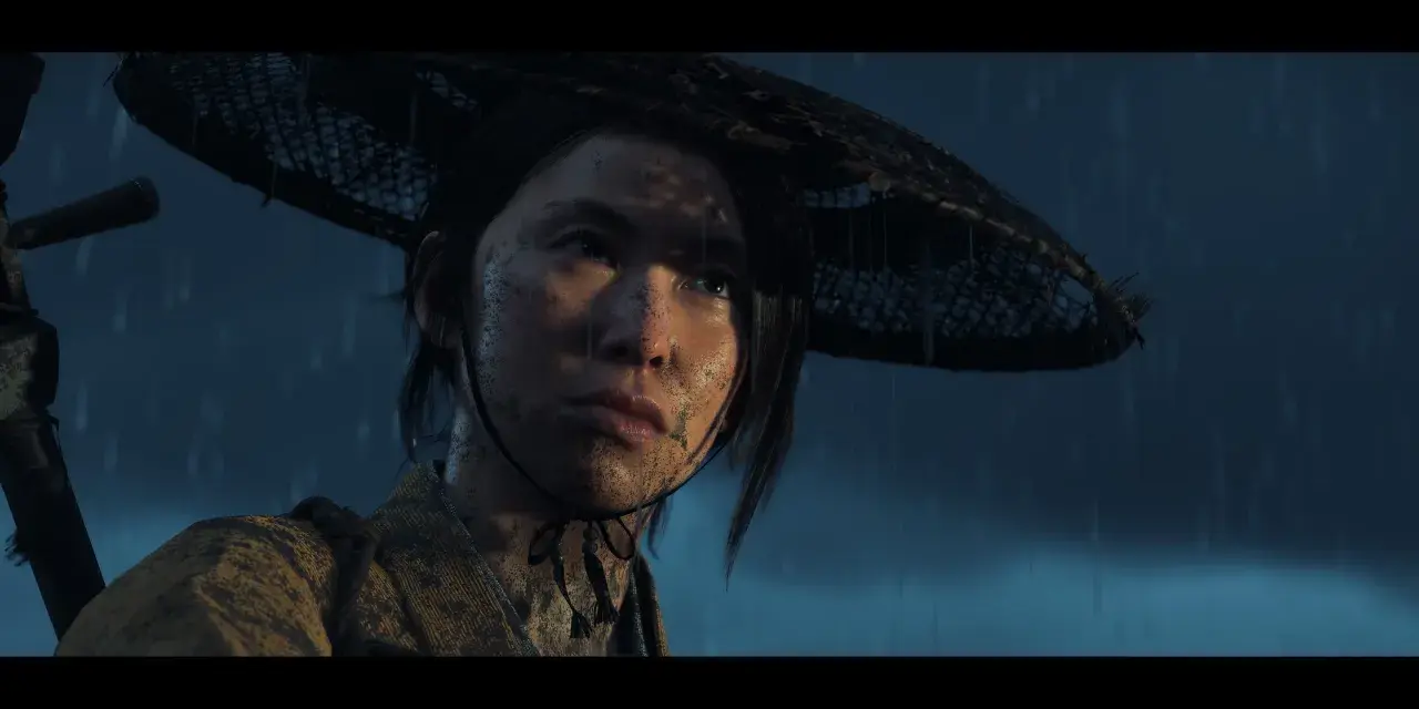 Młoda kobieta w deszczu, z błotem na twarzy, w tradycyjnym stroju i kapeluszu. Czy to zapowiedź Ghost of Tsushima 2?