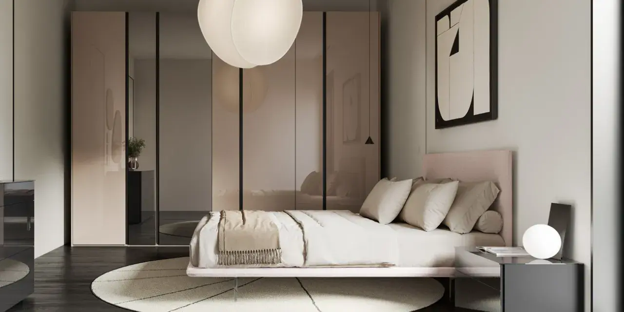 Camera da letto in una casa moderna, con letto rosa, armadio a specchio e lampada a sospensione.