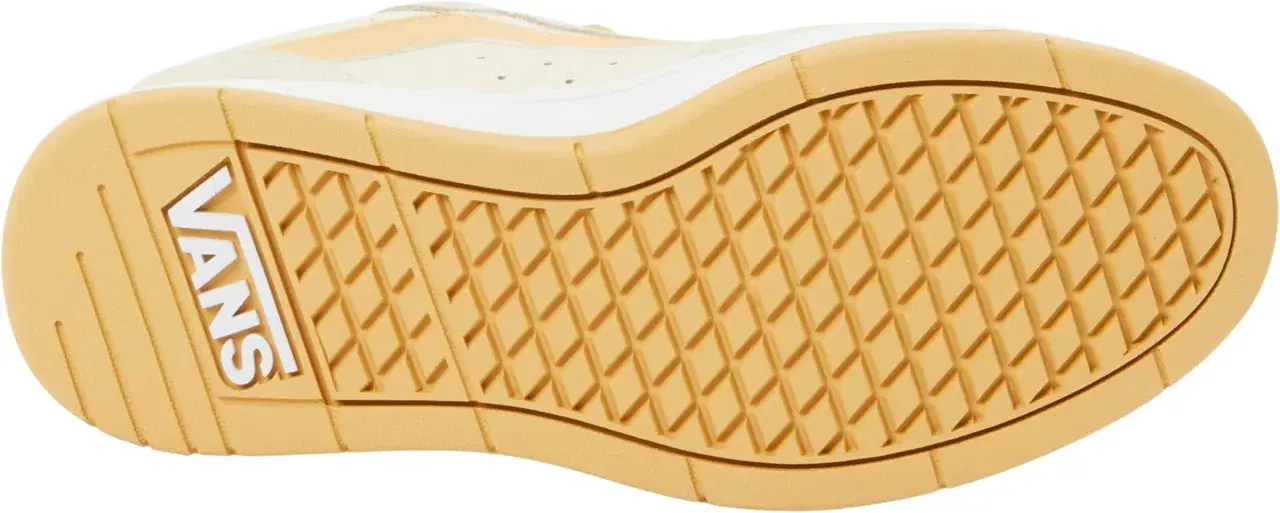 Suela de zapatilla Vans con patrón de rombos y logo blanco. Ideal para tu guía de tallas Vans.