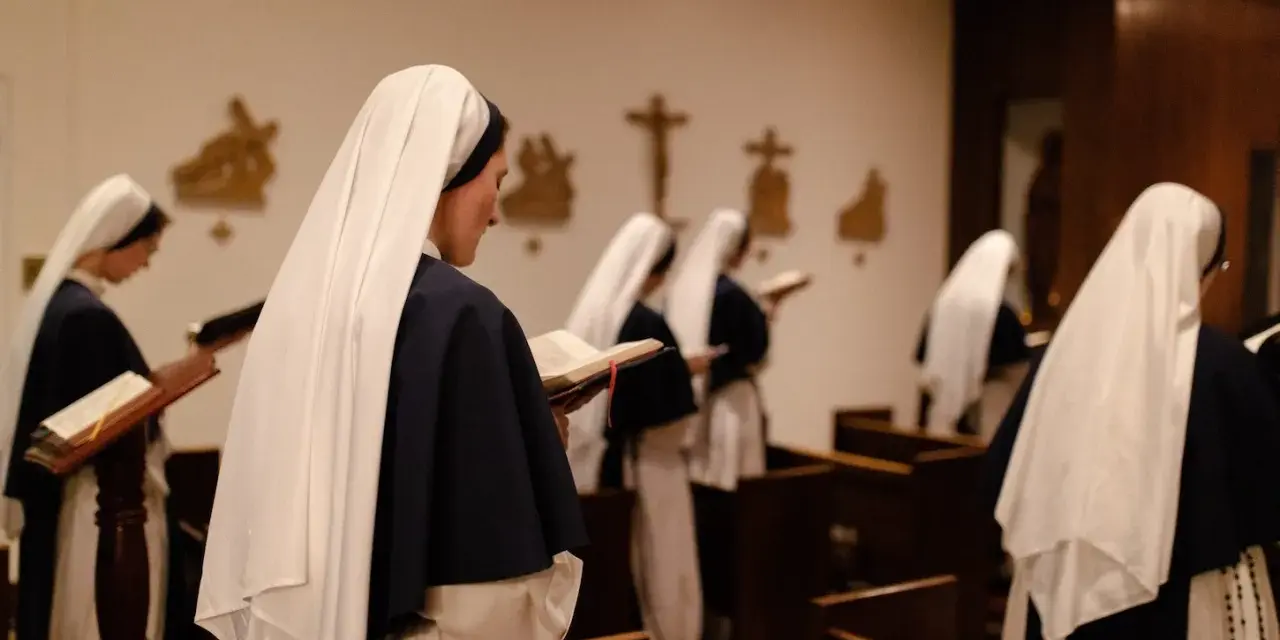 Nuns in a chapel reading from books. This scene offers a glimpse into how to join a monastery female, showcasing devotion and study.