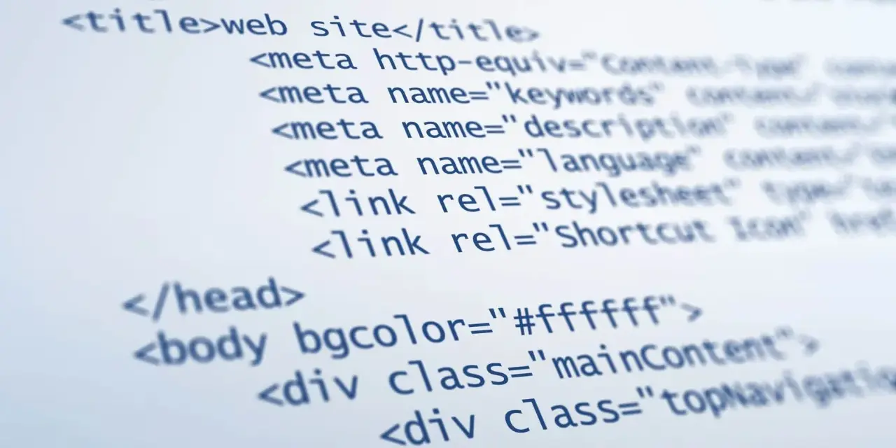 Fragment kodu HTML, pokazujący podstawy tworzenia strony internetowej: doctype, head z tytułem i meta tagami, oraz body z atrybutami i divami.