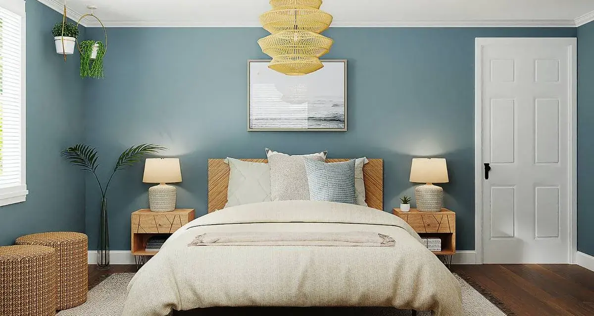 Habitación con paredes azul petróleo, cama acogedora y detalles en madera. Ideas de colores para habitaciones que inspiran calma y serenidad.