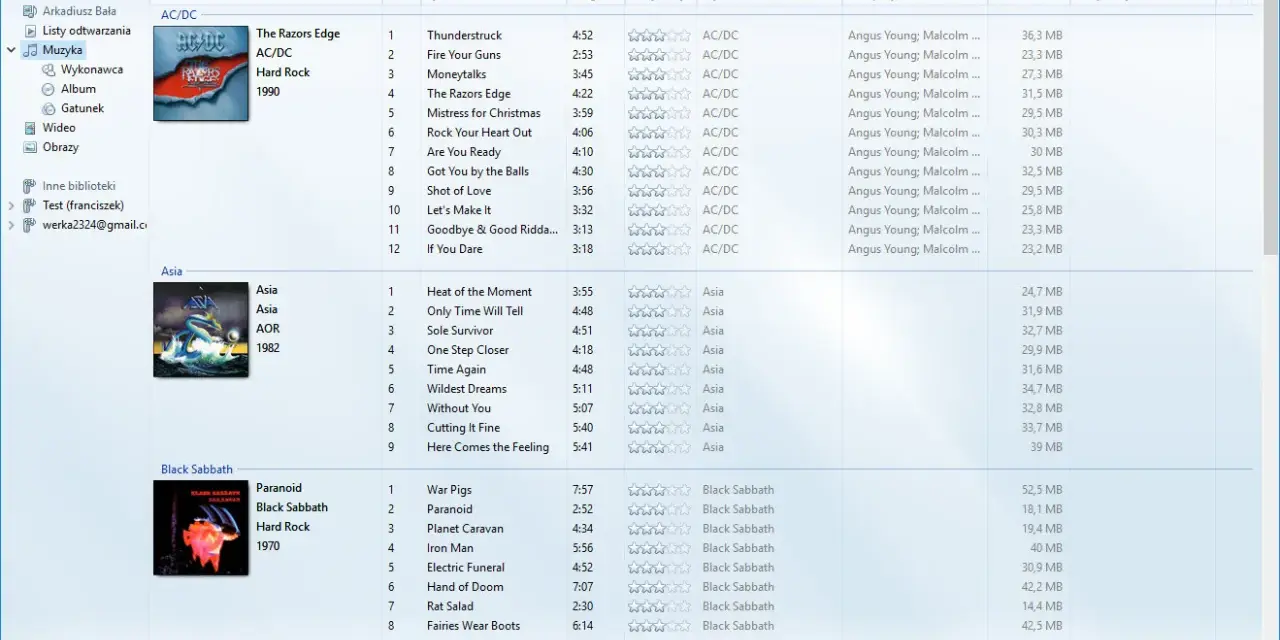 Windows Media Player z listą utworów AC/DC, Asia i Black Sabbath.