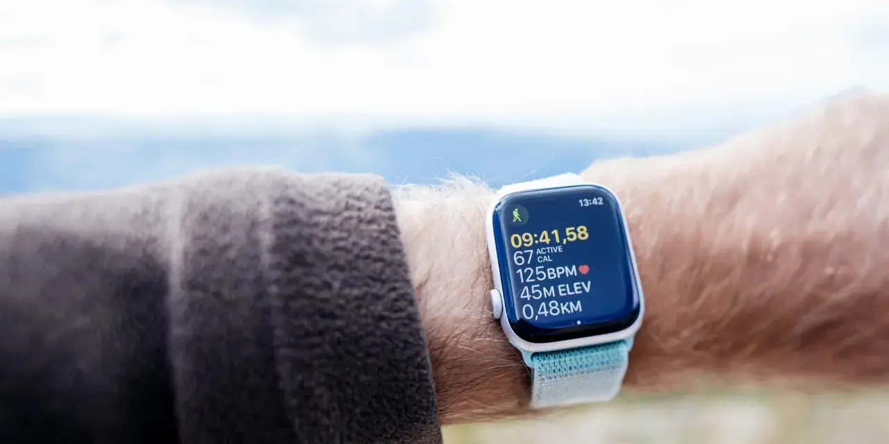 An Apple Watch displays cycling metrics, including time, calories, heart rate, elevation, and distance. It's a great tool for tracking your VO2 max during outdoor activities.
