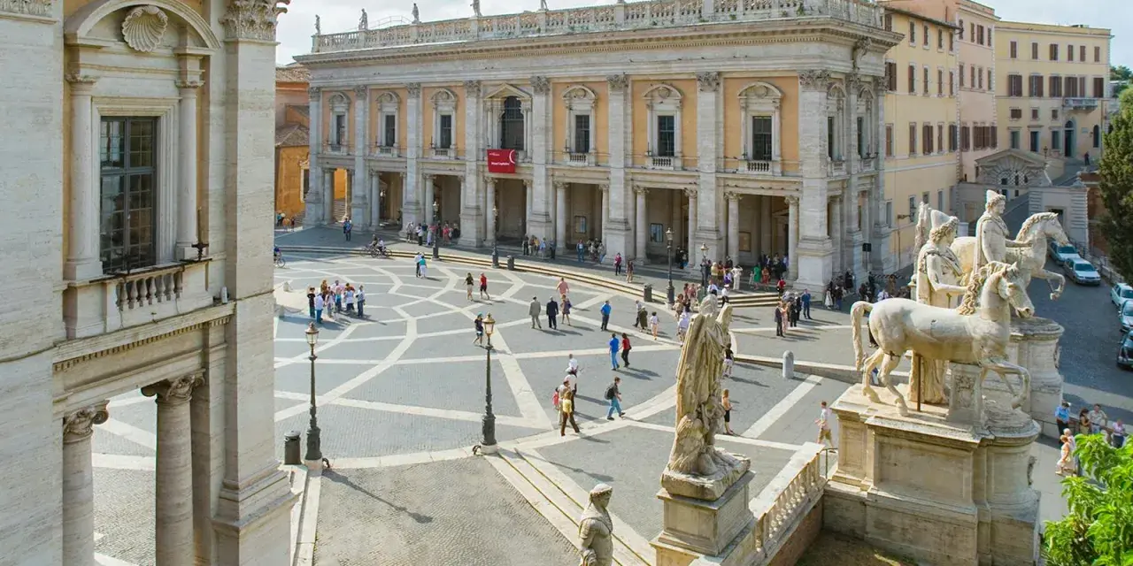 Piazza del Campidoglio, Rome, with the Capitoline Museums' facade and statues.