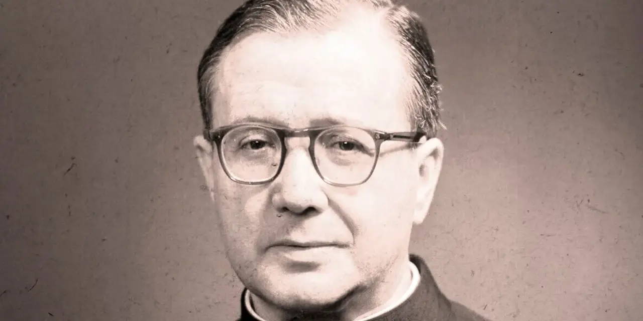 Portrait of a man in clerical attire, wearing glasses. His thoughtful gaze suggests an opus work of God, a life dedicated to faith and service.