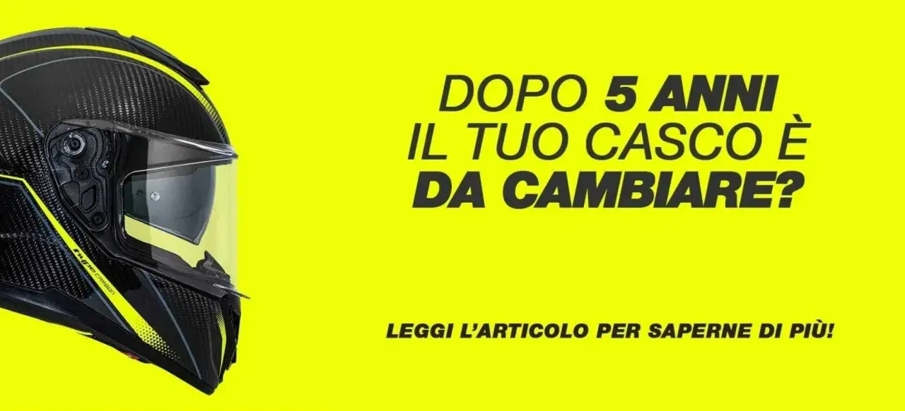 Casco da moto in carbonio con grafica gialla, con testo che chiede se il casco è da cambiare dopo 5 anni, rispettando l'e11 omologazione.