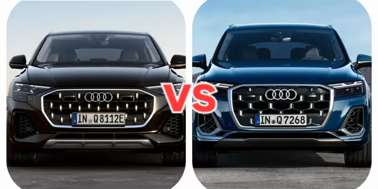 Dwa Audi Q7, czarne i niebieskie, z napisem VS pośrodku.