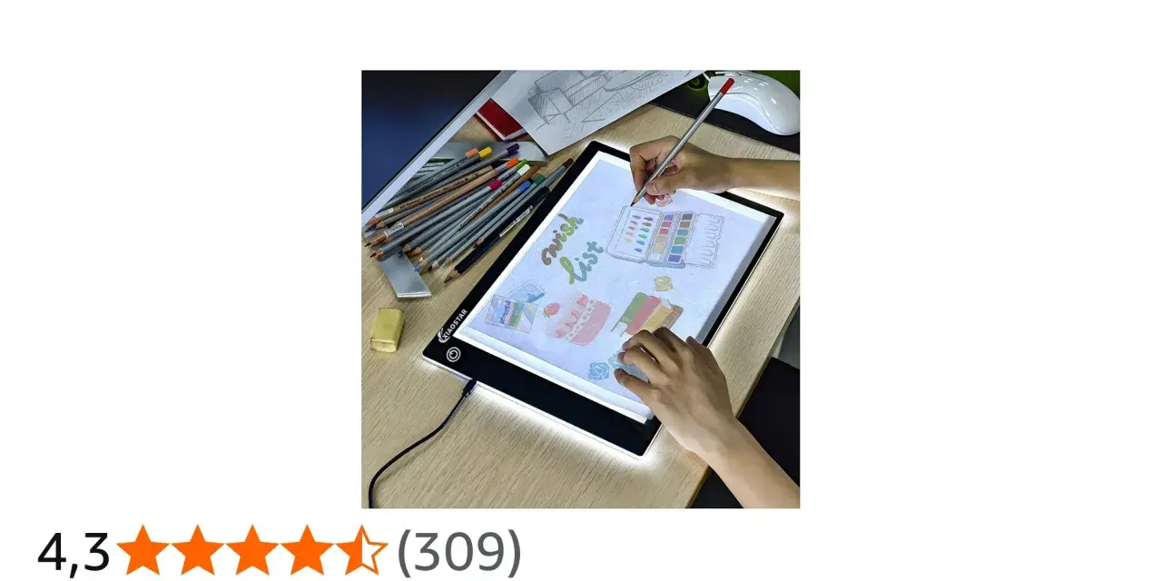 En person använder ett ljusbord för att rita en "wish list" med färgpennor och akvareller.