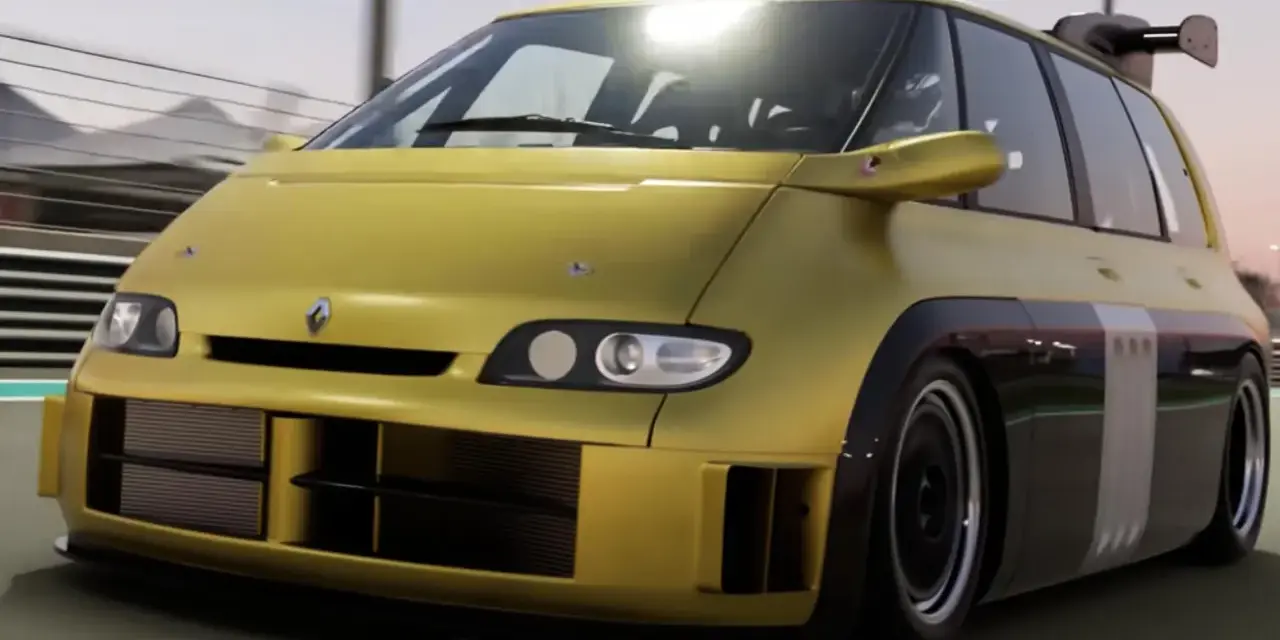 Żółty Renault Espace F1 z potężnym spojlerem pędzi po torze wyścigowym.