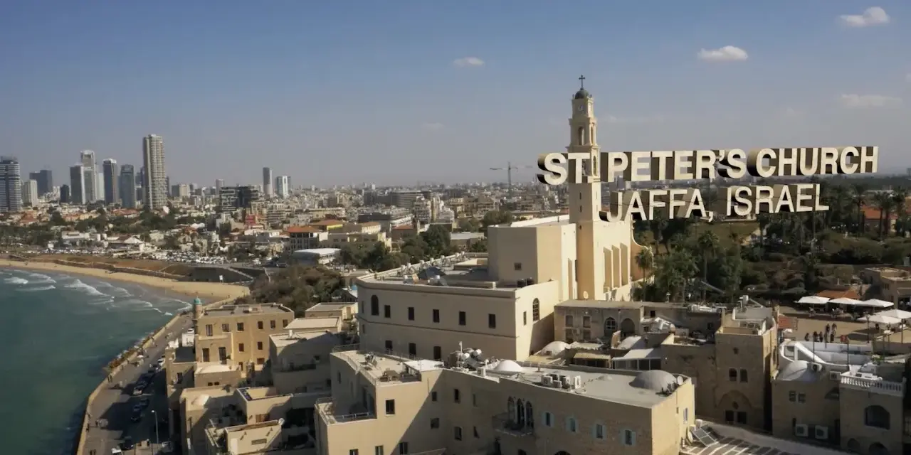 St. Peter's Church in Jaffa, Israel, a city with deep roots in the bible, overlooks the Mediterranean Sea and a modern skyline.