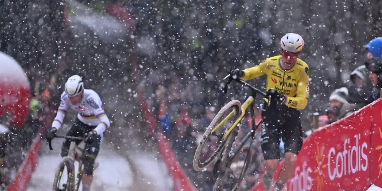 Cyclists battle snowy conditions. Wout van Aert, in yellow, appears to be recovering from a crash, while another rider in white pushes on.