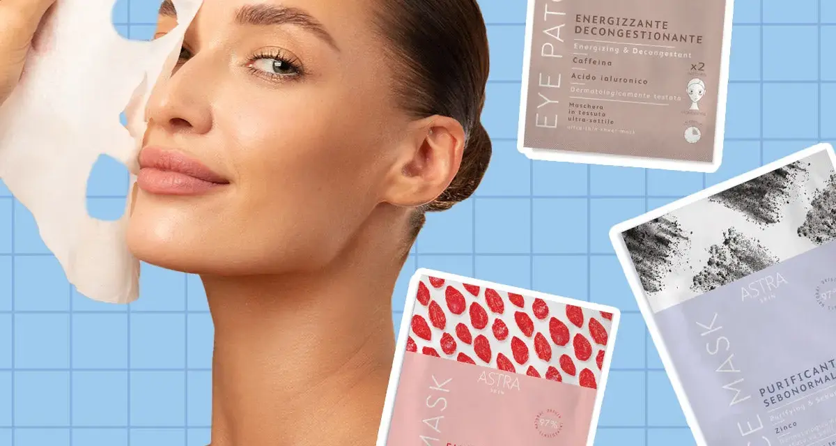 Donna applica una maschera in tessuto sul viso. Diverse confezioni di maschere Astra Skin sono visibili, tra cui una "Eye Patch Energizzante" e due "Face Mask" (una emolliente rivitalizzante e una purificante sebonormale). La maschera in tessuto va ris...