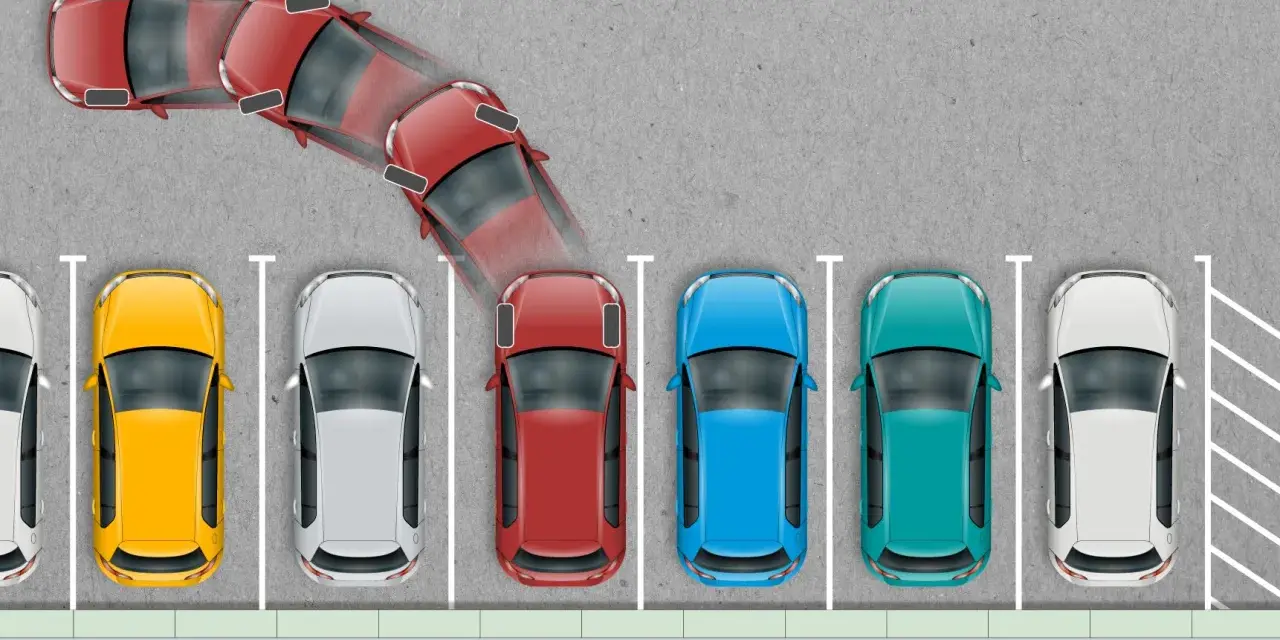 Schemat ilustrujący parkowanie prostopadłe. Czerwony samochód wykonuje manewr wjazdu na miejsce parkingowe.
