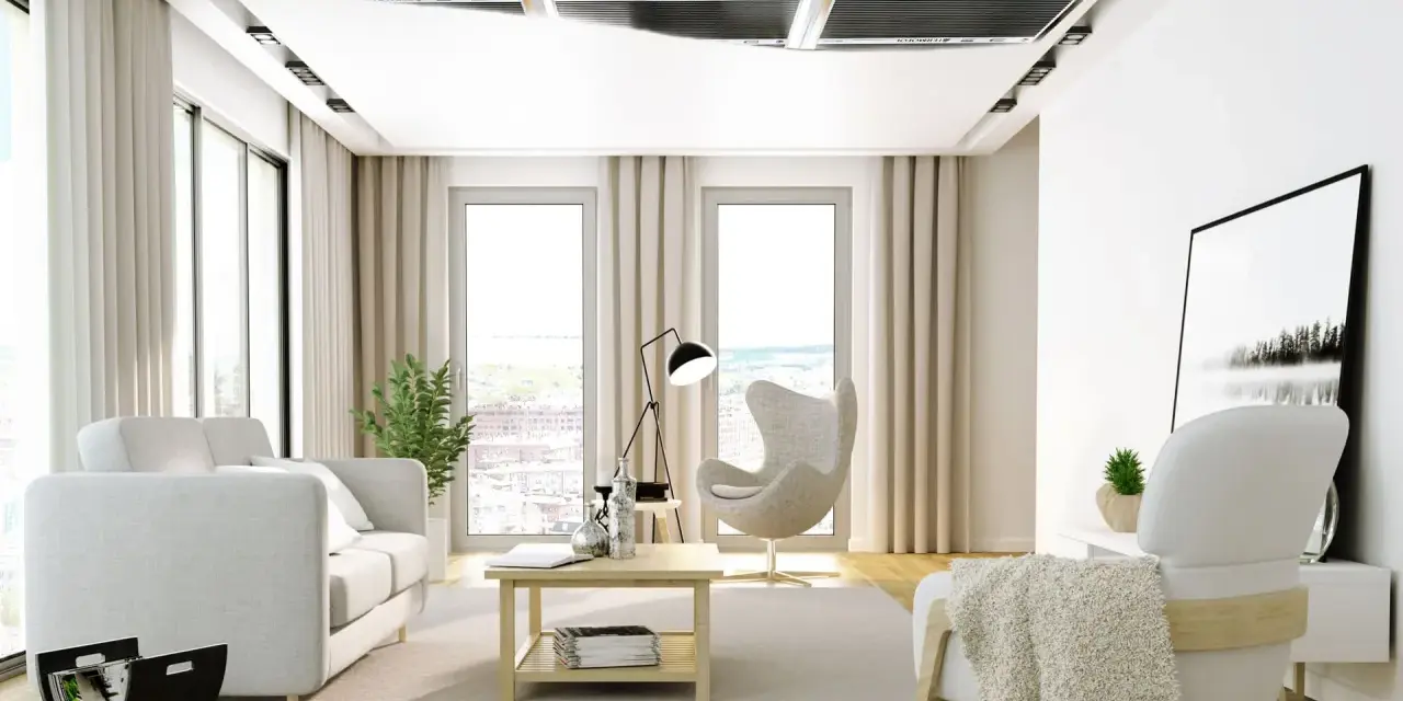 Nowoczesny salon z ogrzewaniem sufitowym. Jasne meble, duże okna i dyskretne panele grzewcze tworzą przytulną atmosferę.