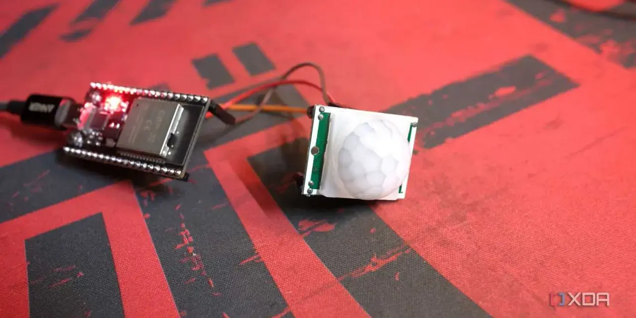 ESP32 board connected to a PIR motion sensor, ready for esp32 presence detection projects.