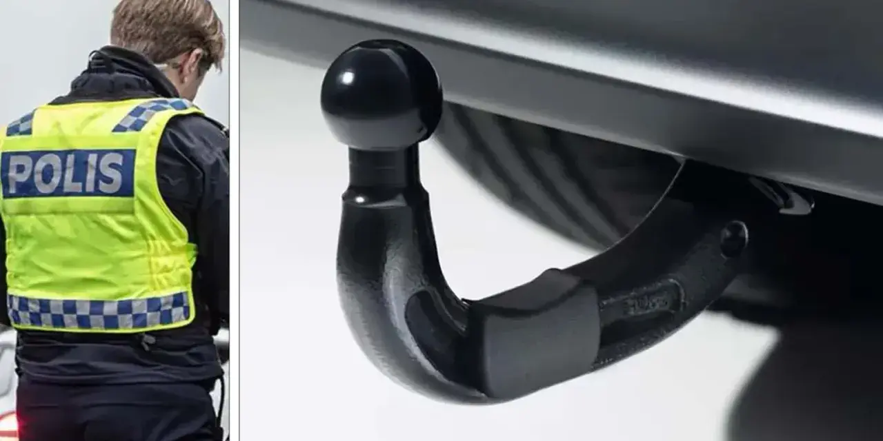 Polis med reflexväst inspekterar dragkrok, en viktig del av husvagns kollen för säker färd.