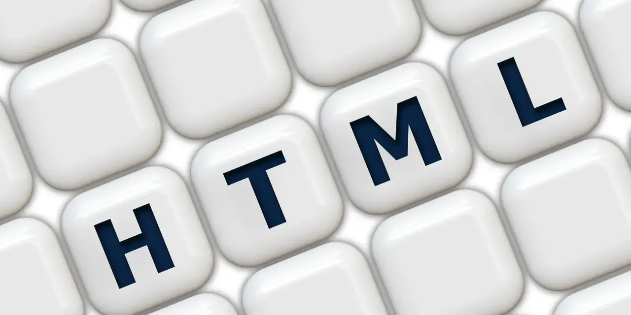 Klawisze z literami H, T, M, L układają się w słowo HTML, symbolizując podstawy programowania.