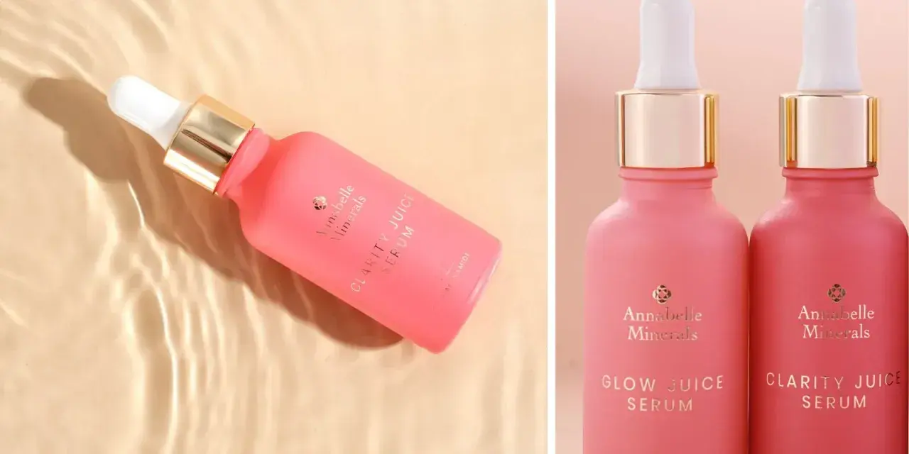 Różowe serum Annabelle Minerals z niacynamidem na trądzik. Dwa flakoniki z pipetką, jeden w wodzie, drugi obok.
