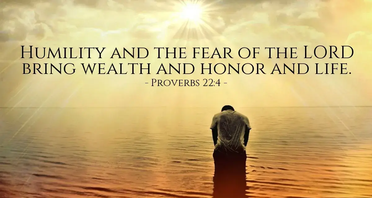 A person kneels in water as the sun shines brightly, illustrating that god lifts up the humble.