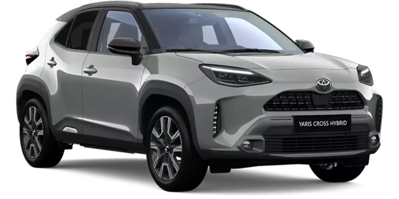 Srebrny Toyota Yaris Cross Hybrid z czarnym dachem, prezentujący nowoczesny design i hybrydowy napęd.