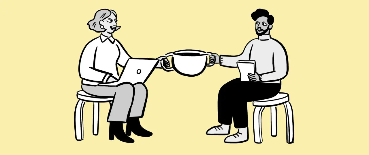 Dos personas sentadas, una con laptop y otra con papeles, comparten una taza de café. Podría ser una reunión para revisar la cuenta contable anticipo acreedores.
