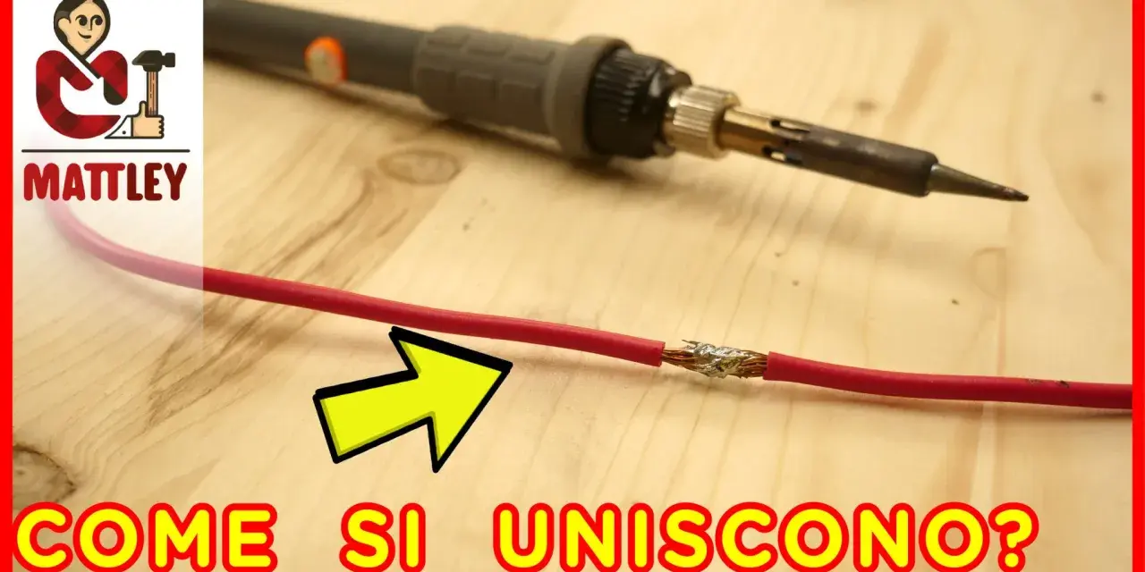 Un saldatore pronto a collegare fili elettrici, con un cavo rosso già unito.